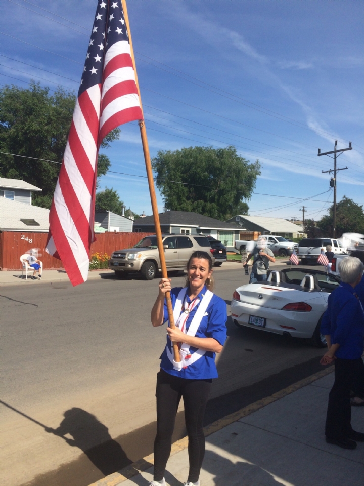 Carrying the American Flag in the Parade
